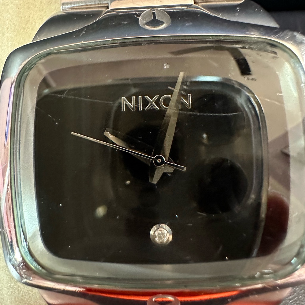 Nixon Modern Silver And Black Timepiece